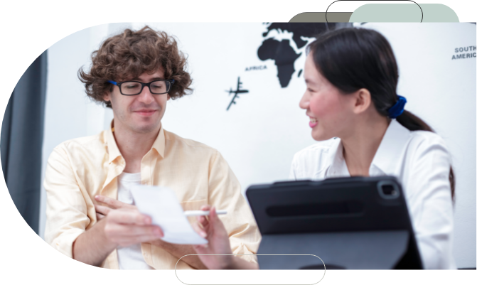 A teacher and student looking at a paper