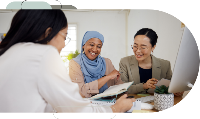 Three women looking at a document together